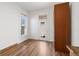Bright bedroom with a large window, hardwood floors, and a built-in wardrobe at 1103 Lipan St, Denver, CO 80204