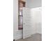 Walk in closet with shelving and a decorative door storage system at 1103 Lipan St, Denver, CO 80204