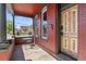 Cozy covered porch with a small table and chairs, string lights, and a view of the surrounding neighborhood at 1103 Lipan St, Denver, CO 80204