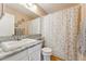 Clean bathroom with granite countertop and shower/tub at 8773 W Star Dr, Littleton, CO 80128