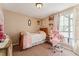 Charming bedroom with light walls and a twin bed at 8773 W Star Dr, Littleton, CO 80128