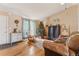 Living room with hardwood floors and Christmas tree at 8773 W Star Dr, Littleton, CO 80128