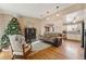 Living room with hardwood floors and Christmas tree at 8773 W Star Dr, Littleton, CO 80128