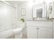 Bathroom featuring updated vanity with granite countertop, stylish fixtures, and a shower at 3855 S Monaco St # 208, Denver, CO 80237