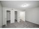 Carpeted bedroom featuring closets, neutral paint and ample natural light for a calm and inviting space at 3855 S Monaco St # 208, Denver, CO 80237