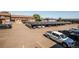 Community parking lot featuring covered parking with solar panels at 3855 S Monaco St # 208, Denver, CO 80237