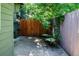 A view of the patio and backyard, with a wooden fence on the right and 2 lawn chairs at 4248 Corriente Pl, Boulder, CO 80301