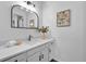 Bright bathroom featuring a modern vanity, stylish mirror, and elegant decor at 4248 Corriente Pl, Boulder, CO 80301