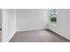 This bedroom is brightly lit from the natural light of the window and has carpeted floors at 4248 Corriente Pl, Boulder, CO 80301