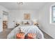 Well-lit bedroom featuring neutral tones, bedside lamps, stylish decor, and comfortable furniture at 4248 Corriente Pl, Boulder, CO 80301