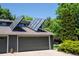 Exterior of home with solar panels, garage, and well-maintained yard at 4248 Corriente Pl, Boulder, CO 80301
