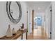 Inviting hallway with a decorative mirror and hardwood floors at 4248 Corriente Pl, Boulder, CO 80301