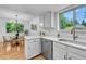 Kitchen area includes stainless steel appliances, bright light and an eat in dining area at 4248 Corriente Pl, Boulder, CO 80301