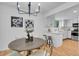 Updated kitchen with white cabinets, modern appliances, and adjacent dining area at 4248 Corriente Pl, Boulder, CO 80301
