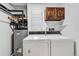 Functional laundry room featuring a washer, dryer, and storage solutions at 4248 Corriente Pl, Boulder, CO 80301
