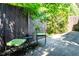 Cozy backyard patio area with metal chairs, small table, and privacy fence at 4248 Corriente Pl, Boulder, CO 80301