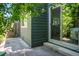 A view of the patio, with sliding glass doors and a small window at 4248 Corriente Pl, Boulder, CO 80301