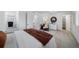 Serene bedroom with a comfortable bed, stylish decor, and a view of the en suite bathroom at 13615 E 103Rd Ave, Commerce City, CO 80022