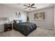 Comfortable bedroom featuring a ceiling fan, plush carpet, and a bright window view at 2246 N Coronado Pkwy # A, Denver, CO 80229
