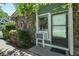 Close-up of a home's entryway featuring stone detail and an air conditioner unit at 2246 N Coronado Pkwy # A, Denver, CO 80229