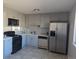 Updated kitchen featuring stainless steel appliances, sleek countertops, and modern gray cabinetry at 2246 N Coronado Pkwy # A, Denver, CO 80229