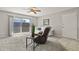 Bright living room with sliding glass door, ceiling fan, and a comfortable sofa at 2246 N Coronado Pkwy # A, Denver, CO 80229