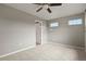 Spacious bedroom with neutral walls, carpet, and two windows offering plenty of natural light at 3672 S Perth Cir # 101, Aurora, CO 80013