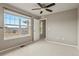 Bright bedroom with large window, neutral walls, and plush carpet for a cozy and inviting space at 3672 S Perth Cir # 101, Aurora, CO 80013