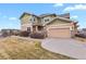 Charming home featuring a two-car garage, landscaped front yard, and inviting exterior at 3672 S Perth Cir # 101, Aurora, CO 80013
