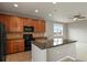 Well-lit kitchen featuring granite countertops, stainless steel appliances, and tiled backsplash at 3672 S Perth Cir # 101, Aurora, CO 80013