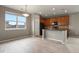 Bright kitchen with modern appliances, natural light, and wood-style flooring at 3672 S Perth Cir # 101, Aurora, CO 80013