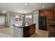 Modern kitchen with granite countertops, stainless steel appliances, and sleek design at 3672 S Perth Cir # 101, Aurora, CO 80013