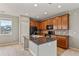 Modern kitchen featuring an island with granite countertops and stainless-steel appliances at 3672 S Perth Cir # 101, Aurora, CO 80013