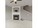Inviting living room with fireplace and staircase, providing a cozy and functional space at 3672 S Perth Cir # 101, Aurora, CO 80013