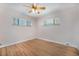 Bright bedroom with hardwood floors, ceiling fan, and dual windows at 8910 W 4Th Ave, Lakewood, CO 80226