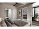 Comfortable bedroom with a large window and views to living room and ensuite bathroom at 1643 Boulder St # 205, Denver, CO 80211