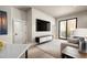 Bright living room featuring a sliding glass door to a balcony and modern furnishings at 1643 Boulder St # 205, Denver, CO 80211