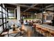 Modern restaurant interior featuring stylish seating arrangements and abundant natural light at 1643 Boulder St # 205, Denver, CO 80211