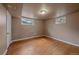 Finished basement bedroom with wood flooring and bright windows at 11972 W Dakota Dr, Lakewood, CO 80228