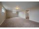 Basement area with neutral walls, carpet flooring, and natural light at 11972 W Dakota Dr, Lakewood, CO 80228