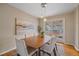 Inviting dining room with warm lighting and slider doors leading to a covered deck at 11972 W Dakota Dr, Lakewood, CO 80228