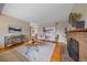 Elegant living room showcasing hardwood floors, a cozy fireplace, and stylish decor at 11972 W Dakota Dr, Lakewood, CO 80228