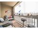 Inviting balcony with a cozy seating area and a grill, perfect for relaxation at 10487 W Hampden Ave # 101, Lakewood, CO 80227