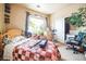 Bright bedroom with natural light, light wood dresser, full closet and room to exercise at 10487 W Hampden Ave # 101, Lakewood, CO 80227