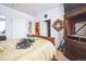 Cozy bedroom with a large bed and a view of the bathroom at 10487 W Hampden Ave # 101, Lakewood, CO 80227