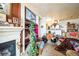 Bright and airy living space with fireplace, furniture, and decorative shelves at 10487 W Hampden Ave # 101, Lakewood, CO 80227