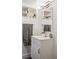 This bathroom features white cabinets and shelves with storage, a towel rack, and a modern silver faucet at 190 W Archer Pl, Denver, CO 80223