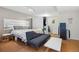 Bedroom featuring a gray sofa, and closet at 190 W Archer Pl, Denver, CO 80223