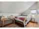 Bedroom with hardwood floors, window and stylish desk area at 190 W Archer Pl, Denver, CO 80223