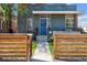 Inviting entrance with a modern blue front door, decorative wreath, and well-manicured walkway at 190 W Archer Pl, Denver, CO 80223